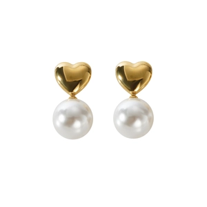 French vintage heart-shaped gold stud earrings with white pearls on a white background