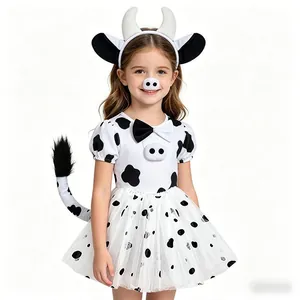 Detailed close-up of cow costume set including headband, nose, bowtie, tail and dress