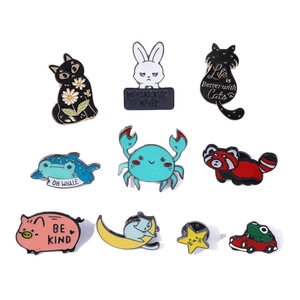 Set of 10 cute cartoon animal enamel pins featuring cats, whales, and frogs in bright colors