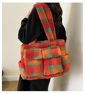 Close-up of a large plush tote bag featuring colorful checkered pattern and front pockets
