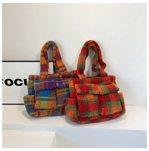 Detailed view of colorful checkered plush tote bags on minimalist geometric stands