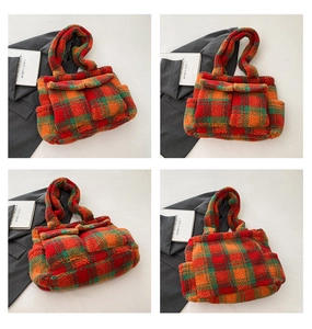 Detail view of large checkered plush tote bag with functional front flap pockets