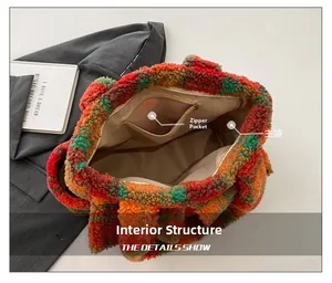Detail showing the inner main compartment and zippered pocket of the plush tote bag