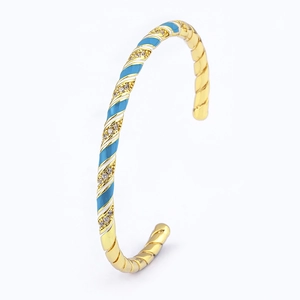 18k gold plated bohemian cuff bracelet with blue enamel drip and shimmering zircon details