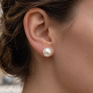 Close-up of 10-12mm freshwater pearl earring with 18K gold plated copper on model ear