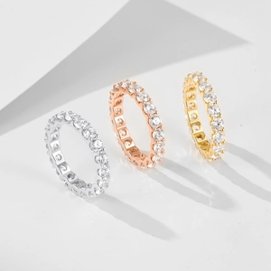 Three eternity bands in silver, rose gold, and gold finish with cubic zirconia stones