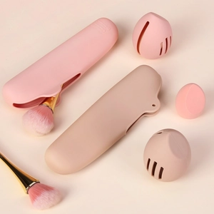 Detail view of pink silicone makeup sponge holder and brush case with ventilation holes