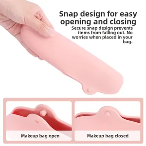 Detail of pink silicone makeup brush case featuring secure buckle closure and portable design