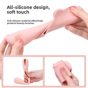Pink silicone makeup brush cover showing flexible texture and soft touch design