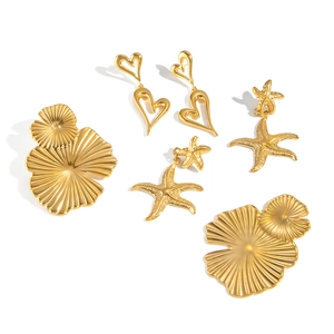 Three pairs of golden stainless steel earrings including heart, starfish and petal designs