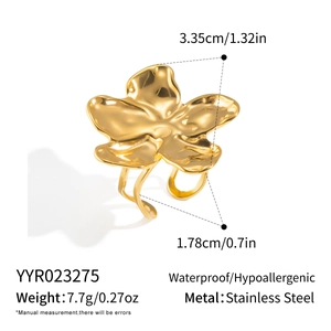 Macro view of gold stainless steel flower ring with waterproof and hypoallergenic features