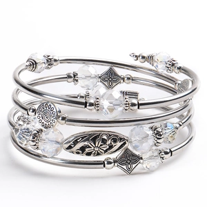 Multi-layer wrap bracelet featuring turquoise beads and vintage silver charms
