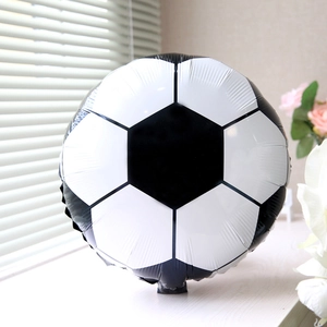 Close-up of 18 inch soccer foil balloon with glossy black and white hexagonal patterns