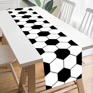 Close-up of a polyester table runner with a classic black and white football hexagon pattern