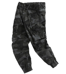 Detail of dark grey camo cargo pants featuring drawstring waist and large flap pockets