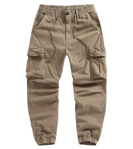 Detail of khaki cargo pants featuring elastic drawstring waist and large side flap pocket