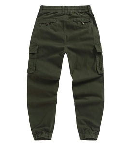 Detail view of dark green cargo pants featuring elastic waist and back flap pockets