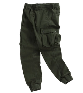 Detail of olive green cargo pants showing elastic drawstring waist and large flap pockets