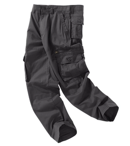 Detail of dark grey cargo pants featuring functional flap pockets and metal zippers