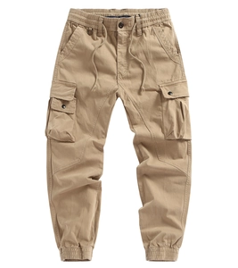 Detail view of khaki cargo pants featuring elastic drawstring waist and tactical side pockets
