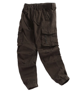 Detail of dark cargo pants featuring a drawstring waist and side zip utility pockets