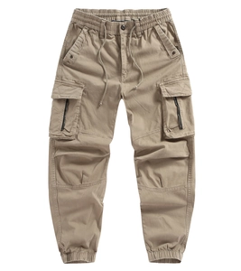 Detailed view of khaki cargo pants with elastic waist drawstring and side utility pockets