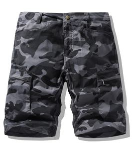 Detailed view of camo cargo shorts featuring large side pockets and zipper accents