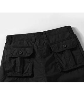 Detail view of the back waist and cargo pockets on black durable tactical work trousers