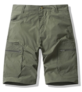 Detail view of cargo shorts with large flap pockets and secure metal zippers on fabric
