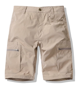 Close-up detail of khaki cargo shorts with reinforced stitching and zippered side pockets