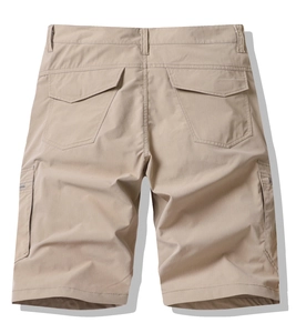Back view of khaki cargo shorts showing heavy-duty pockets and twill cotton fabric texture