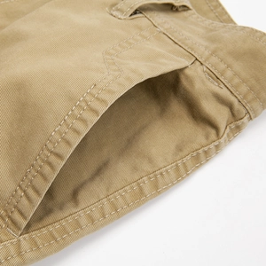 Men's khaki multi-pocket outdoor cargo pants with reinforced stitching and twill texture