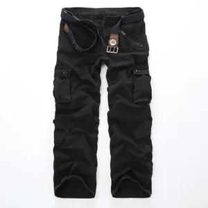 Men's loose fit black cargo pants with multiple pockets and a woven belt for outdoors