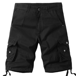 Detail of black cargo shorts featuring tactical flap pockets and adjustable drawstring cuffs