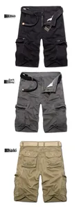 Detail view of cargo shorts in black and grey showing pockets and woven belt