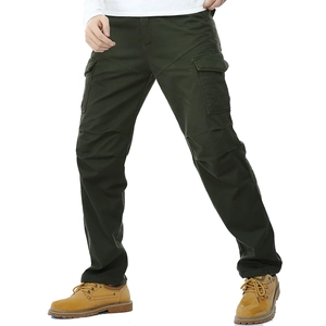 Detail view of dark green cargo pants featuring flap pockets and tactical stitching