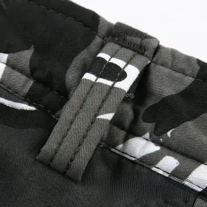 Men's camouflage cargo pants featuring reinforced belt loops and durable double-stitch details