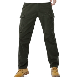 Close-up of military olive cargo pants with side flap pockets and reinforced knee panels
