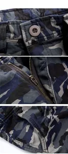 Detail of camouflage cargo pants featuring metal zipper, button waist, and side pocket stitching