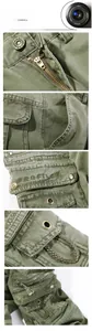 Detail of heavy-duty olive cargo pants showing metal zipper and reinforced stitching
