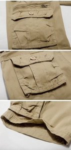 Primer plano de pantalones cortos cargo caqui con bolsillos de solapa y cremallera metálica