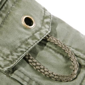 Olive green cargo pants with durable canvas fabric and metallic eyelet drawstring detail