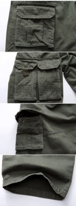 Close-up of military green cargo pants featuring reinforced seams and durable flap pockets