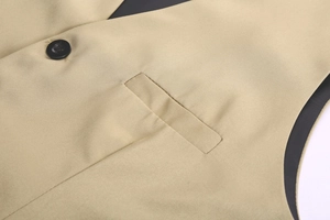 Close-up of khaki V-neck suit vest showing twill fabric texture and black resin button