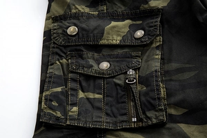 Detail of camouflage cargo shorts featuring double pockets with vintage metal buttons