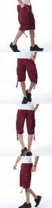Detail of cargo shorts showing multi-pocket design and adjustable drawstring hem in burgundy