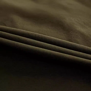 Detailed close-up of army green heavy-duty twill fabric for cargo shorts