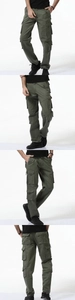 Detail of army green cargo pants featuring large flap pockets and durable cotton twill fabric