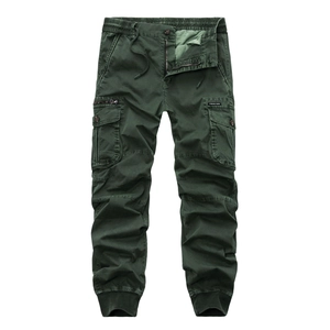 Detailed flat lay of dark green cargo pants with multi-pockets and ribbed cuffs