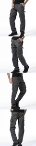 Detail view of dark grey cargo pants featuring side flap pockets and reinforced knee panels